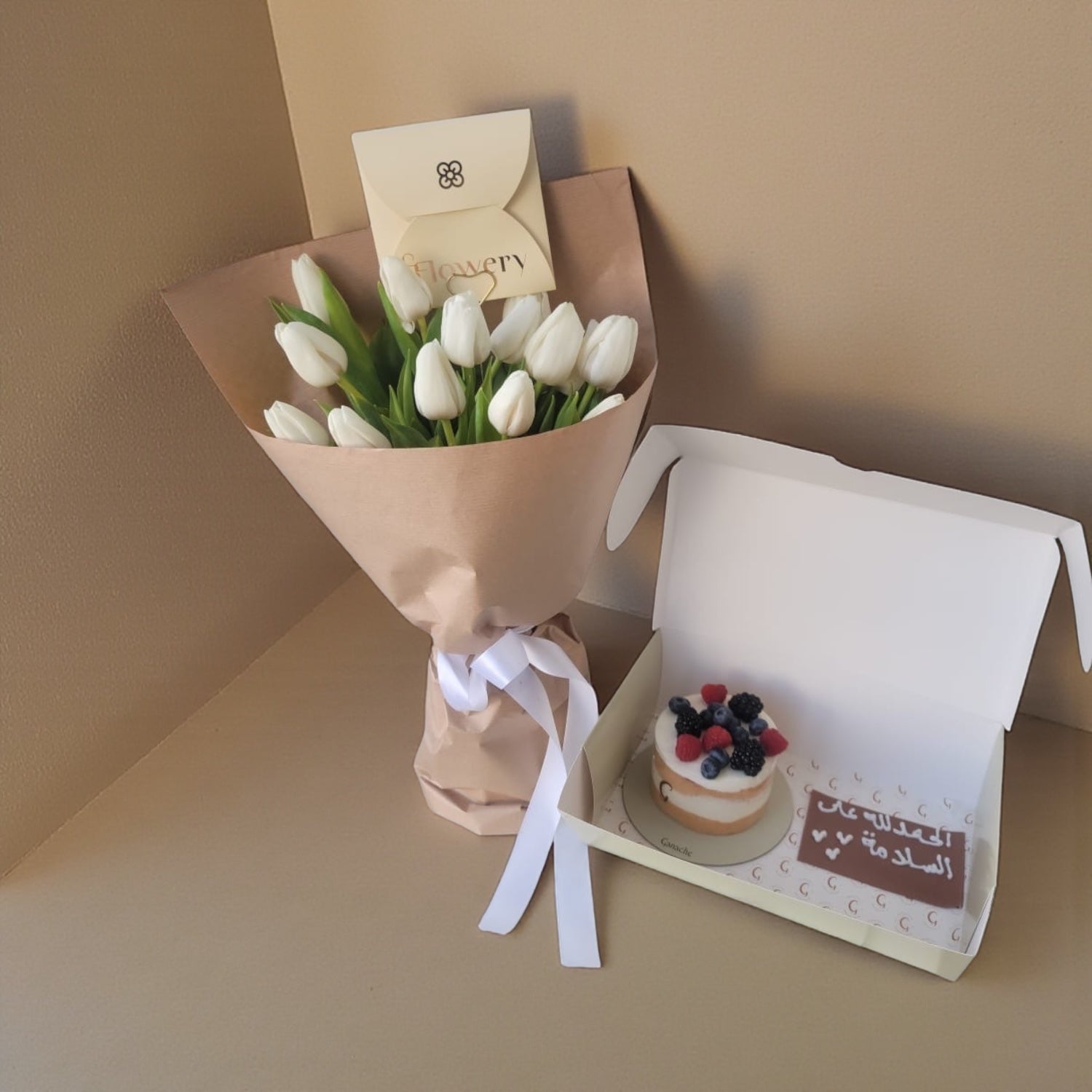 White tulip bouquet with cake
